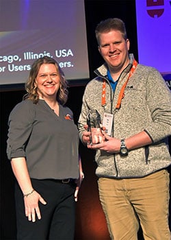 Members’ Choice winner Sam Mills of Eaton (right), receiving his award from Bonnie Meyer in the 2024 AMUG Technical Competition.